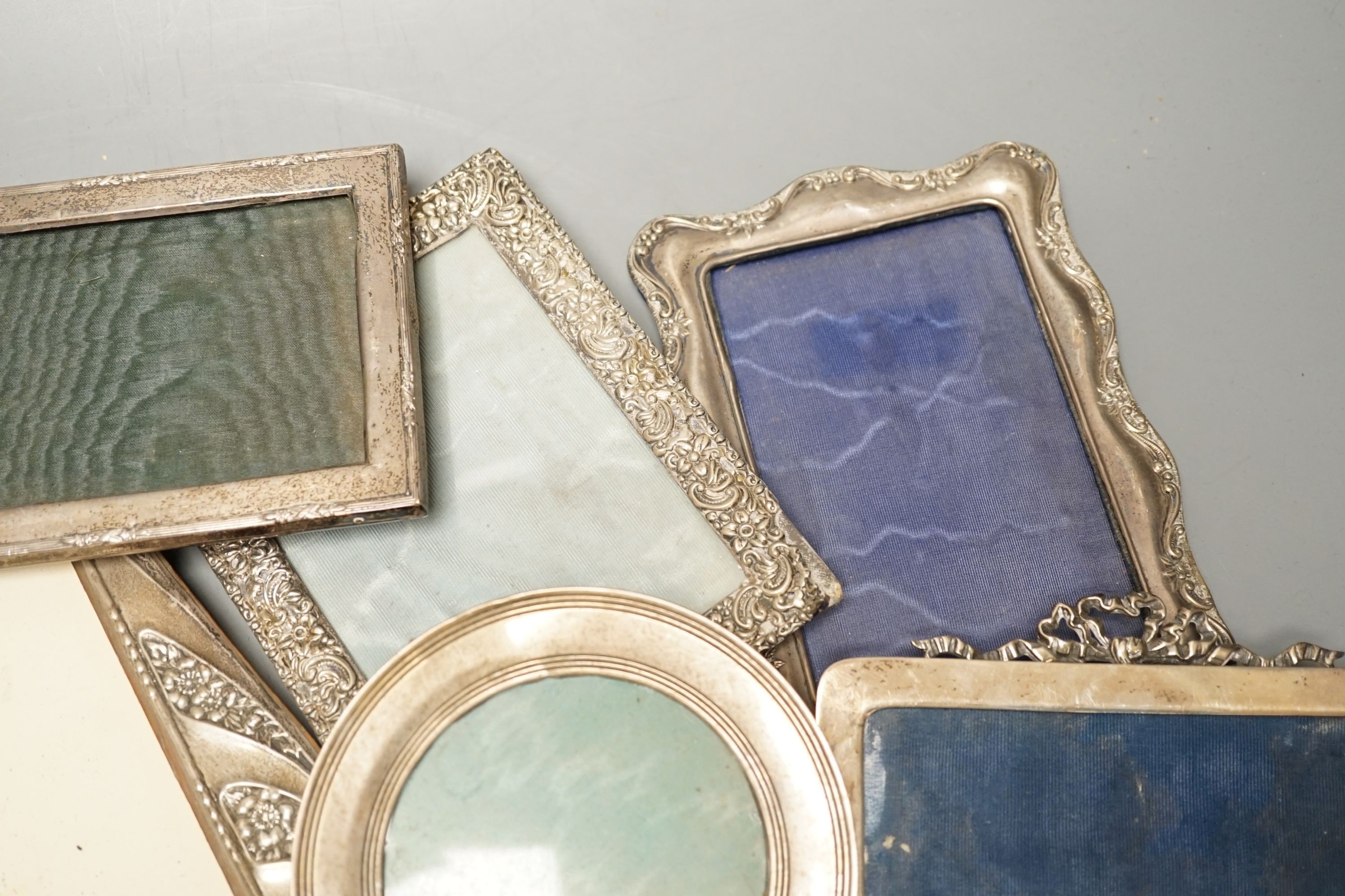 A mixed group of eight various small silver mounted photograph frames, largest 29cm and dated for Birmingham, 1911.